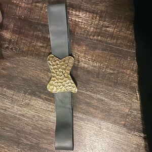 Fashionable Belt Gray leather belt and Gold emblem.